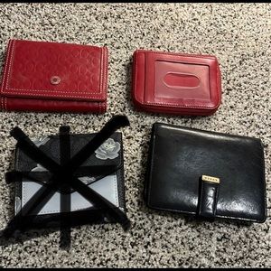 Assortment of small Coach wallets